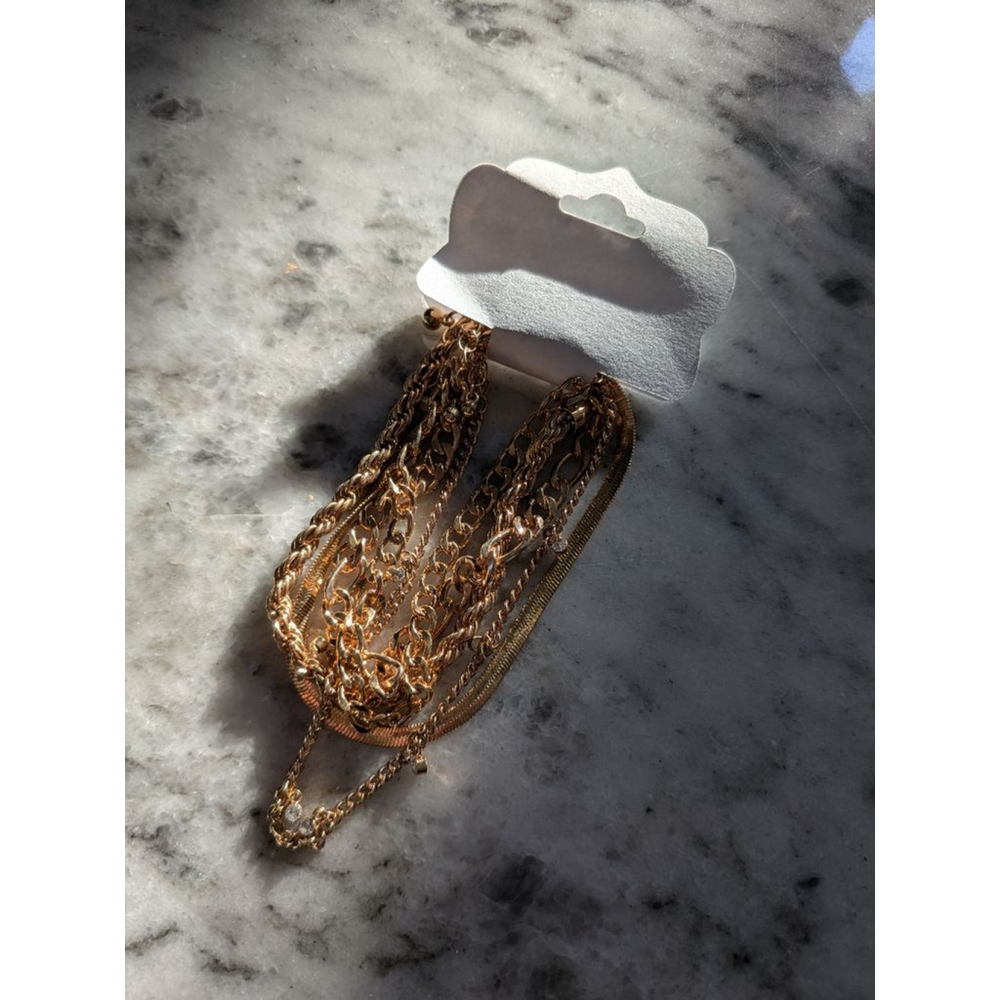 Set of 5 gold toned anklets